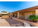 Landscaped backyard featuring a covered patio with comfortable seating and attractive hardscape at 15492 W Whitton Ave, Goodyear, AZ 85395