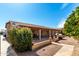 Expansive covered patio with barbecue, decorative hardscape, and landscaping at 15492 W Whitton Ave, Goodyear, AZ 85395