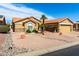 Charming single-story home featuring desert landscaping and a spacious two-car garage at 15492 W Whitton Ave, Goodyear, AZ 85395