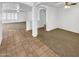 Inviting living area featuring tile and carpet, with arches that create an open and airy feel at 16370 W Rimrock St, Surprise, AZ 85388