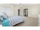 Bright and airy bedroom featuring plush carpeting, neutral tones, and a ceiling fan at 1716 W Weldon Ave, Phoenix, AZ 85015