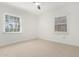 Bright and airy bedroom with plush carpeting, natural lighting, and window blinds at 1716 W Weldon Ave, Phoenix, AZ 85015