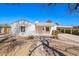 Charming single-story home with a light-colored exterior and a convenient covered carport at 1716 W Weldon Ave, Phoenix, AZ 85015