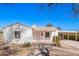 Charming single-story home with a light-colored exterior and a convenient covered carport at 1716 W Weldon Ave, Phoenix, AZ 85015