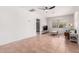 Bright living room with neutral walls, tile floors, and lots of natural light from the window at 1716 W Weldon Ave, Phoenix, AZ 85015