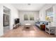 Inviting living room with tile floors, a ceiling fan, and a view of the kitchen at 1716 W Weldon Ave, Phoenix, AZ 85015