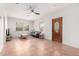 Inviting living room with tile floors, a ceiling fan, and a view of the wooden front door at 1716 W Weldon Ave, Phoenix, AZ 85015