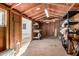 Shed interior featuring plywood walls, an open doorway, and installed shelving on the right side at 1716 W Weldon Ave, Phoenix, AZ 85015