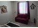 Small bedroom with a futon, art and a treadmill at 17743 W Robin Ln, Surprise, AZ 85387