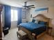 Bedroom with a ceiling fan and a decorative bed at 17743 W Robin Ln, Surprise, AZ 85387