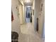 Hallway featuring tile flooring and decor at 17743 W Robin Ln, Surprise, AZ 85387