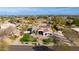 Aerial view of a home showcasing its well-maintained landscaping, sparkling pool and green grass at 19864 E Via Del Oro --, Queen Creek, AZ 85142