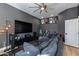 Media room showcasing a comfortable seating area, large screen TV, and sports memorabilia on display at 19864 E Via Del Oro --, Queen Creek, AZ 85142