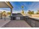 Outdoor kitchen featuring a gas grill, ice maker, and view of pool at 19864 E Via Del Oro --, Queen Creek, AZ 85142