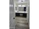 Bathroom with double sink vanity and modern wood-look tile flooring at 21748 W Sonora St, Buckeye, AZ 85326