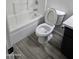 Bright bathroom featuring a toilet, bathtub and tile flooring at 21748 W Sonora St, Buckeye, AZ 85326