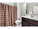 Bathroom with a shower curtain, a toilet, and a vanity with a sink at 22754 W Moonlight Path, Buckeye, AZ 85326