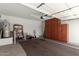 Spacious garage with built-in storage cabinets and a water heater at 22754 W Moonlight Path, Buckeye, AZ 85326