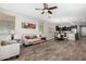 Living room showcasing the open floor plan with sight lines to dining area and kitchen at 22754 W Moonlight Path, Buckeye, AZ 85326