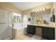 Bathroom featuring a soaking tub, glass shower, and vanity with granite countertop at 23843 N 73Rd St, Scottsdale, AZ 85255