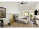 Bright bedroom featuring a pool view, ceiling fan, and neutral decor at 23843 N 73Rd St, Scottsdale, AZ 85255