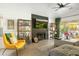 Bright living room with cozy seating, a fireplace, and a TV, perfect for relaxing and entertaining at 23843 N 73Rd St, Scottsdale, AZ 85255