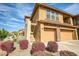 Charming home exterior showcasing desert landscaping and attached two-car garage at 2425 W Bronco Butte Trl # 2024, Phoenix, AZ 85085