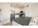 Bright kitchen featuring an island with gray countertop and stainless steel appliances at 2425 W Bronco Butte Trl # 2024, Phoenix, AZ 85085