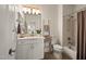 Bright bathroom featuring a vanity, decorative ladder, toilet, and shower-tub combo at 2425 W Bronco Butte Trl # 2030, Phoenix, AZ 85085