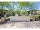 Community grilling area with two stainless steel grills, landscaping, and surrounding condos at 2425 W Bronco Butte Trl # 2030, Phoenix, AZ 85085