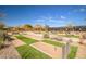 Community horseshoe pit area with manicured landscaping and seating at 2425 W Bronco Butte Trl # 2030, Phoenix, AZ 85085