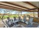 Outdoor kitchen and dining area with a built-in grill, stone countertop, and inviting seating at 2425 W Bronco Butte Trl # 2030, Phoenix, AZ 85085