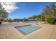 Community pool and hot tub area with ample lounge seating and clear blue skies at 2425 W Bronco Butte Trl # 2030, Phoenix, AZ 85085