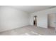 Bright bedroom with neutral carpet and a view into the Primary bathroom at 24653 W Concorda Dr, Buckeye, AZ 85326