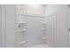 A shower with built-in shelving at 24653 W Concorda Dr, Buckeye, AZ 85326