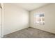 Empty carpeted bedroom with a window at 2544 S 244Th Dr, Buckeye, AZ 85326