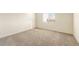 Empty carpeted bedroom with a window at 2544 S 244Th Dr, Buckeye, AZ 85326