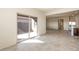 Bright living room featuring tile floors and glass sliding door to the backyard at 2544 S 244Th Dr, Buckeye, AZ 85326