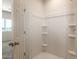 Shower with convenient shelves and bright lighting at 2544 S 244Th Dr, Buckeye, AZ 85326