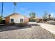 Charming single-story home featuring desert landscaping and a covered carport on a bright, sunny day at 2643 E Virginia Ave, Phoenix, AZ 85008