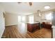 Modern kitchen featuring an island with a cooktop, stainless steel appliances, and hardwood floors at 2643 E Virginia Ave, Phoenix, AZ 85008