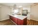 Stylish kitchen featuring a center island, stainless steel appliances, and modern lighting fixtures at 2643 E Virginia Ave, Phoenix, AZ 85008