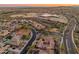 Expansive aerial view of a community highlighting the surrounding landscape and convenient access to nearby areas at 30259 N 125Th Ln, Peoria, AZ 85383