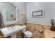 Elegant powder room with decorative mirror, pedestal sink, and designer accents at 30259 N 125Th Ln, Peoria, AZ 85383