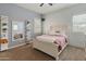 Comfortable bedroom with a shiplap accent wall, plush carpeting, and lots of natural light at 30259 N 125Th Ln, Peoria, AZ 85383