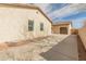 Spacious driveway leads to a terracotta roof home with a two-car garage, surrounded by xeriscape landscaping at 30259 N 125Th Ln, Peoria, AZ 85383