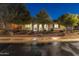 Charming single-story home featuring manicured landscaping and inviting front entryway with stone walkway at 30259 N 125Th Ln, Peoria, AZ 85383