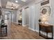 Inviting hallway featuring wood-look tile floors, recessed lighting, and charming decorative accents at 30259 N 125Th Ln, Peoria, AZ 85383