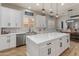 Beautiful kitchen with white cabinets, stainless appliances, and a large kitchen island at 30259 N 125Th Ln, Peoria, AZ 85383