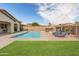 Inviting backyard pool and hot tub area with lounge chairs, ideal for relaxation and enjoying sunny days at 30259 N 125Th Ln, Peoria, AZ 85383